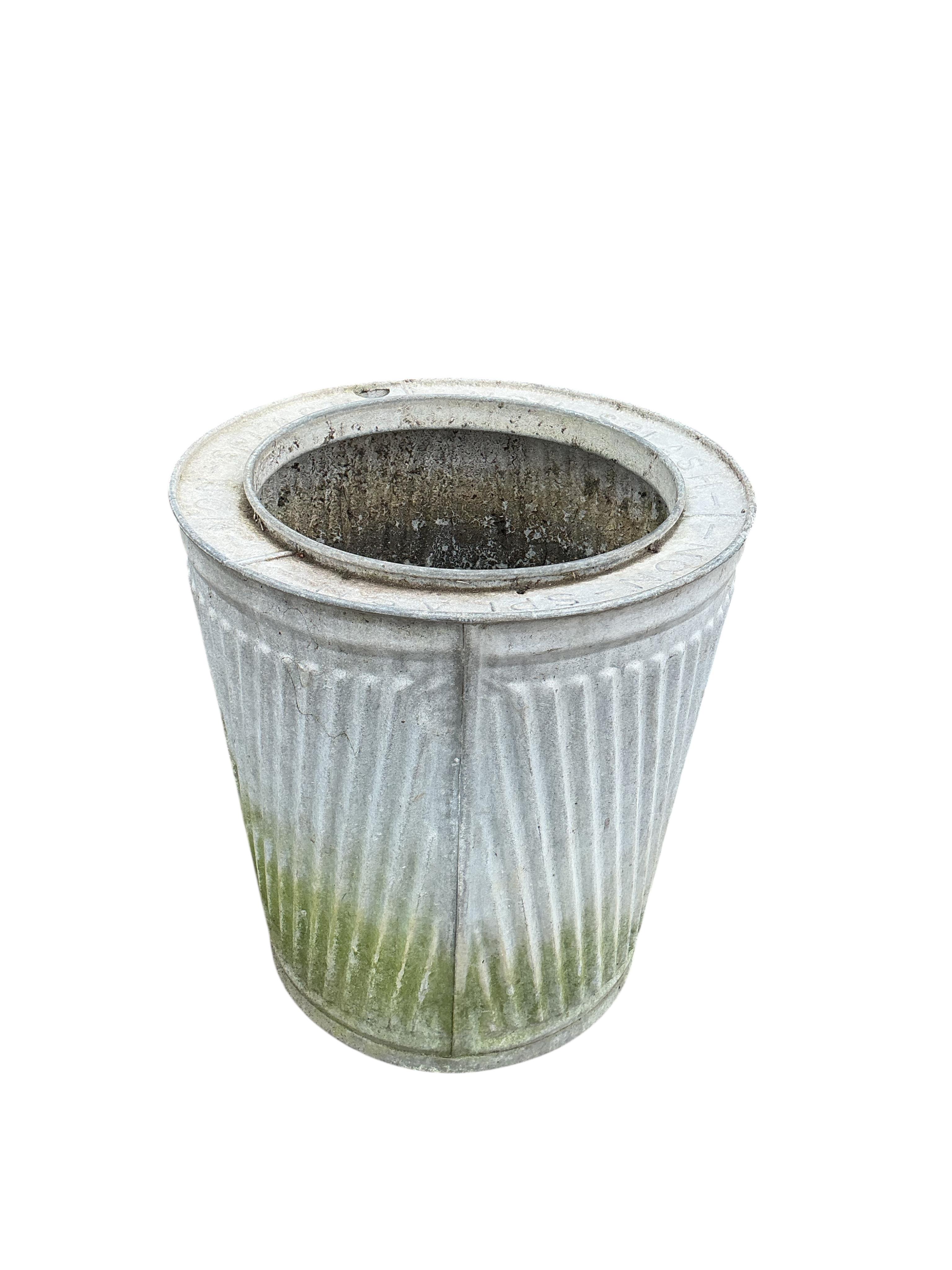 Two galvanised metal barrels, larger diameter 47cm, height 62cm